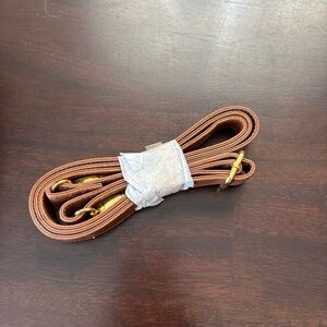 Brand new brown faux leather with gold purse strap